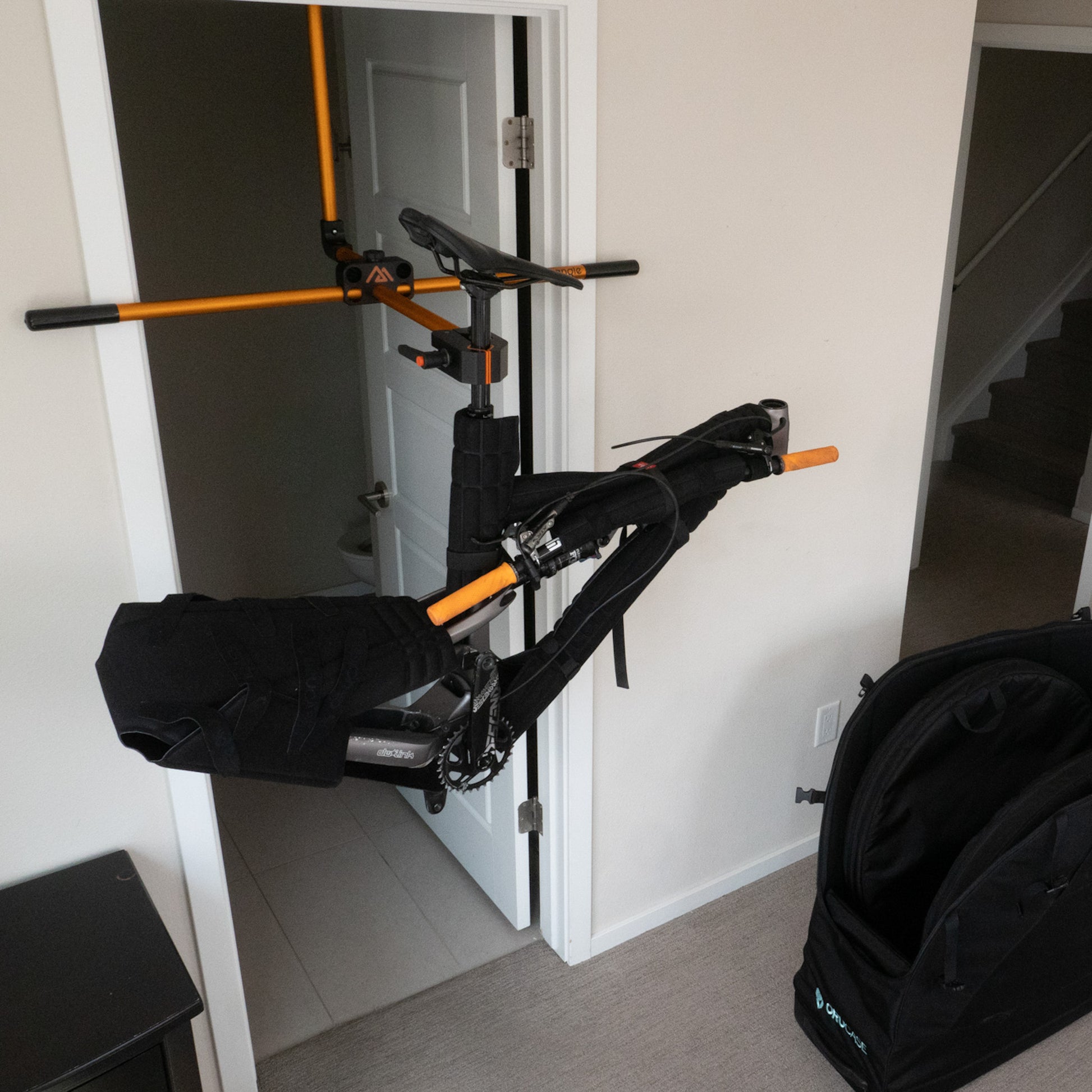 Small bicycle repair stand with bike being reassembled after traveling.