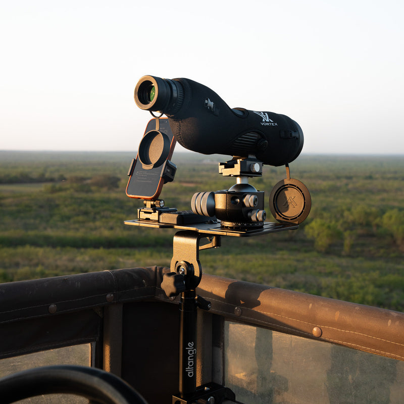 Hub clamped to a UTV roll cage with a spotting scope on top